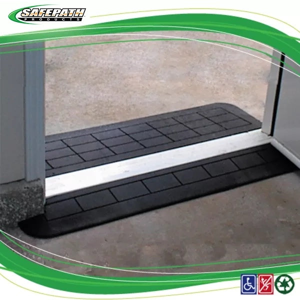 Black rubber step mat with metallic strip on a concrete surface, branded 'SAFEPATH'. EZEdge™ Wheelchair Ramps