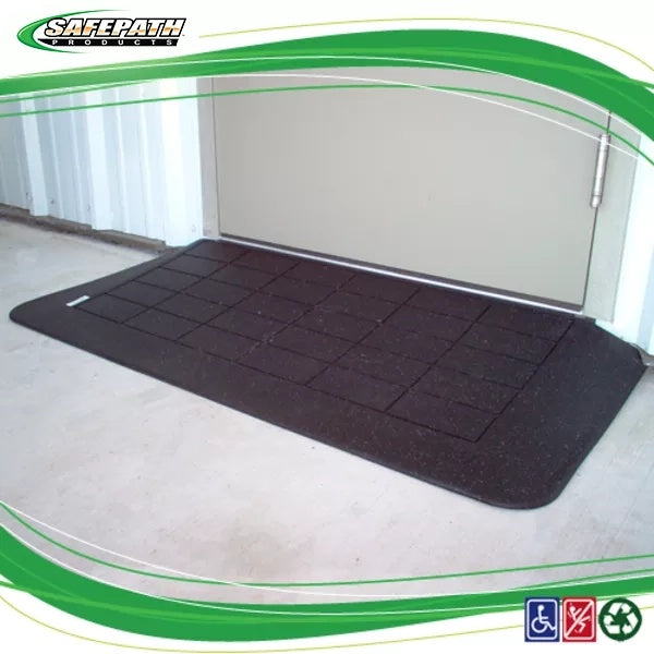 Black garage floor mat with grid pattern on a concrete floor, branded as SafePath Products. EZEdge™ Wheelchair Ramps
