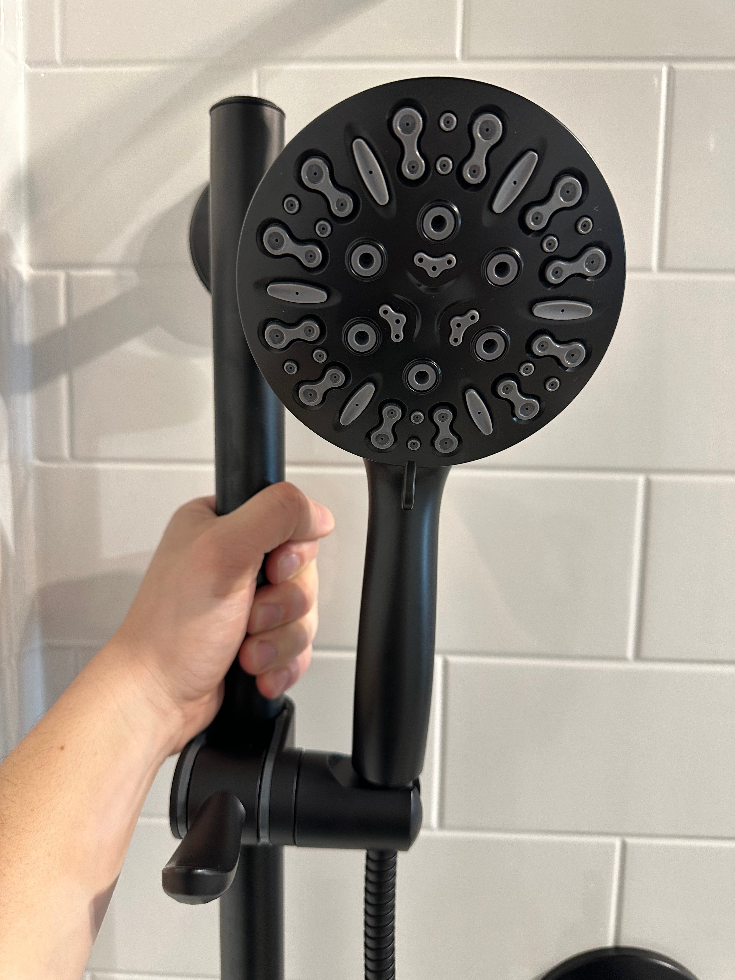 3-in-1 Grabcessories grab bars, slider bar, and 9-spray handheld shower wand with stability, luxury, and multi-function spray settings.