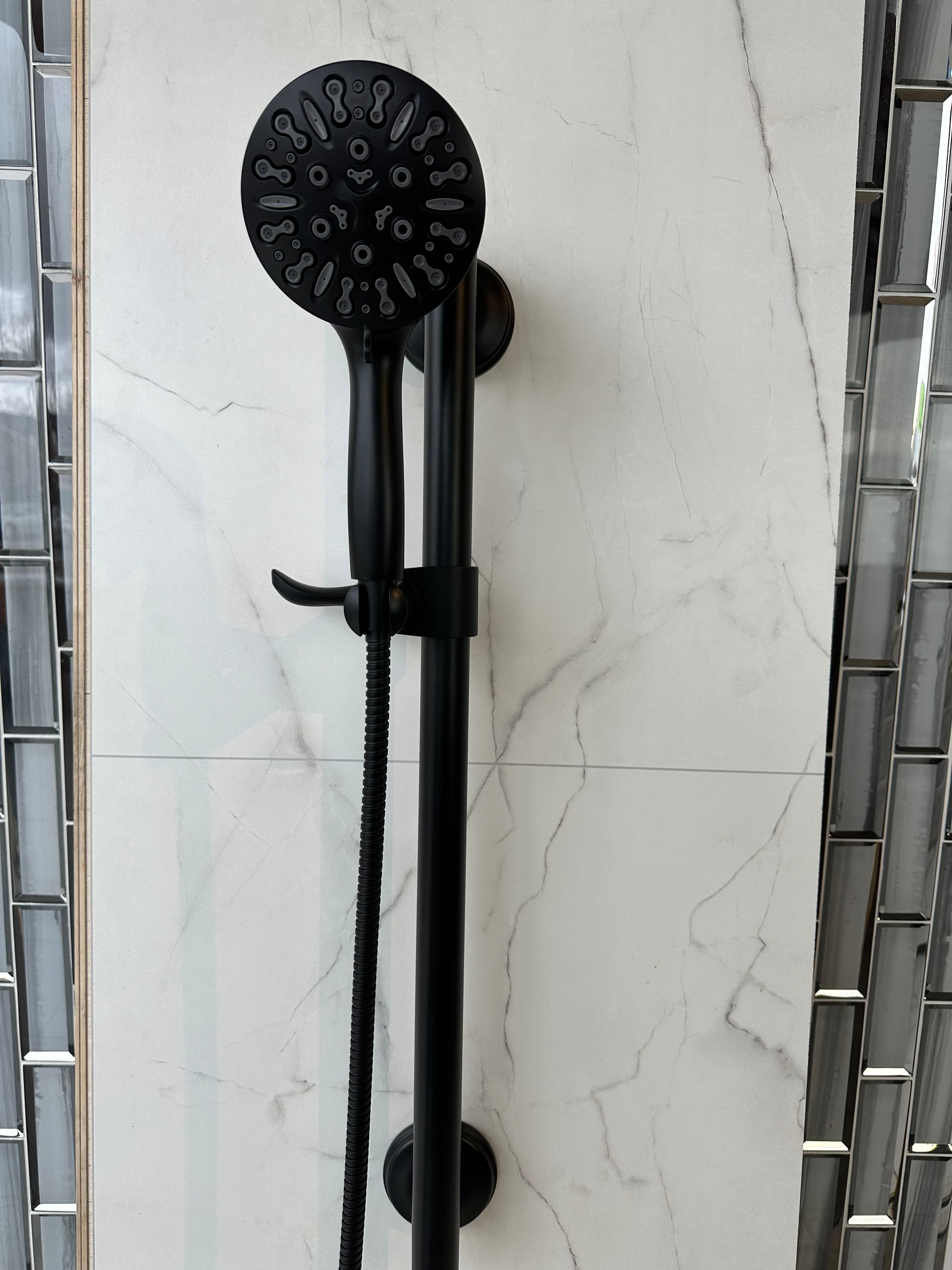 3-in-1 Grabcessories grab bars, slider bar, and 9-spray handheld shower wand with stability, luxury, and multi-function spray settings.