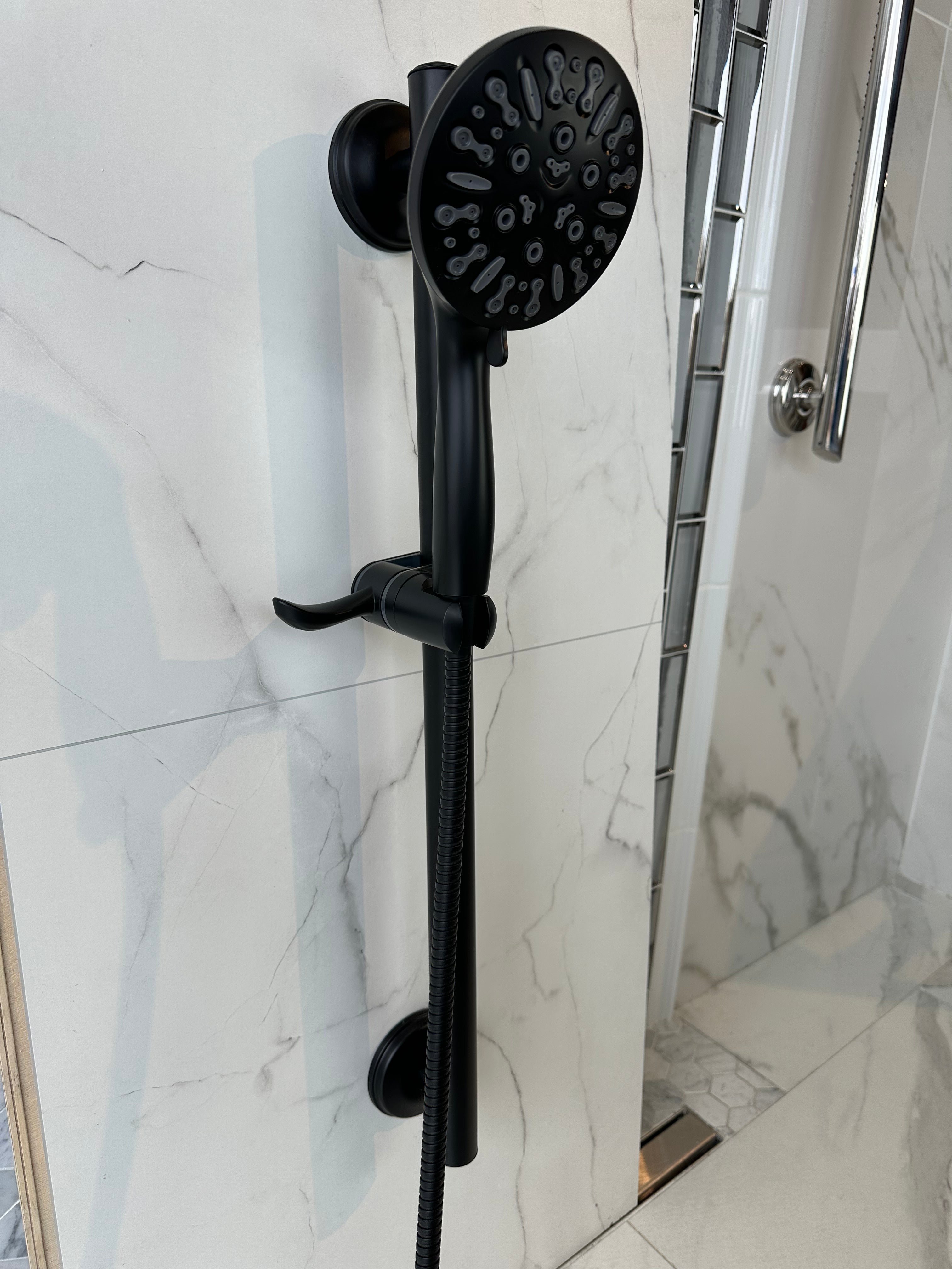 3-in-1 Grabcessories grab bars, slider bar, and 9-spray handheld shower wand with stability, luxury, and multi-function spray settings.
